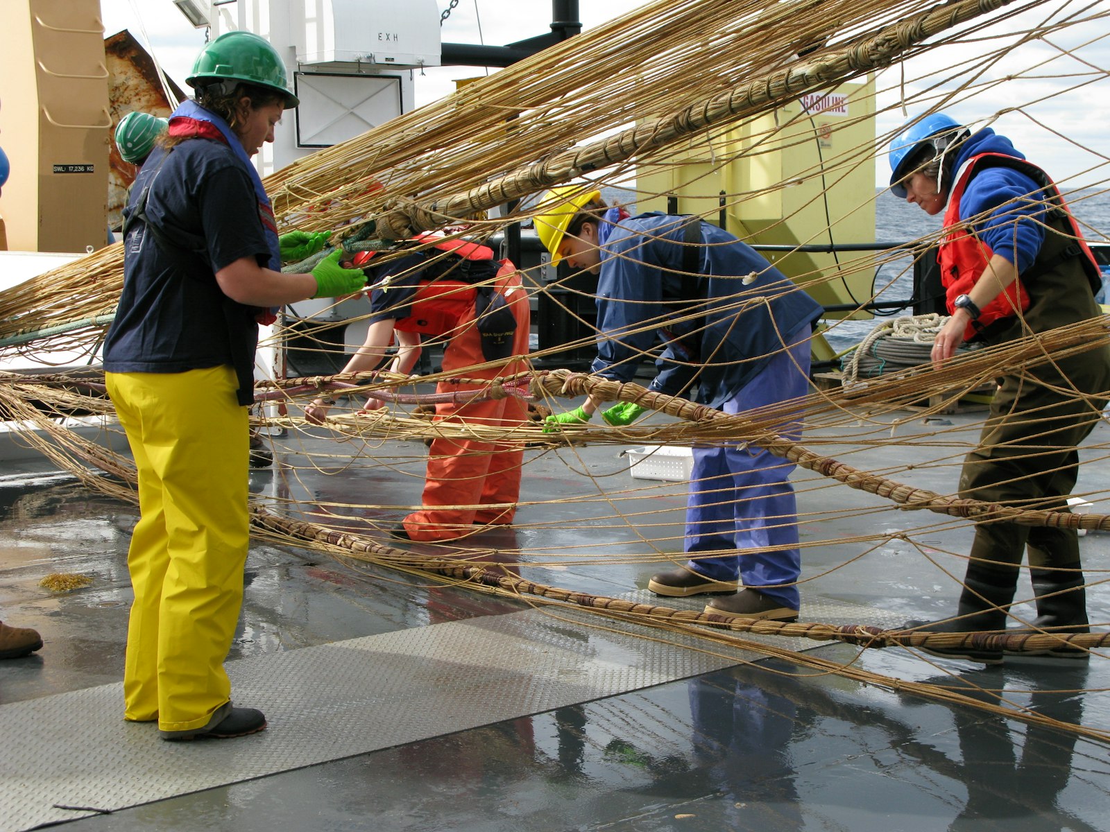 Fishermen working with rope and nets